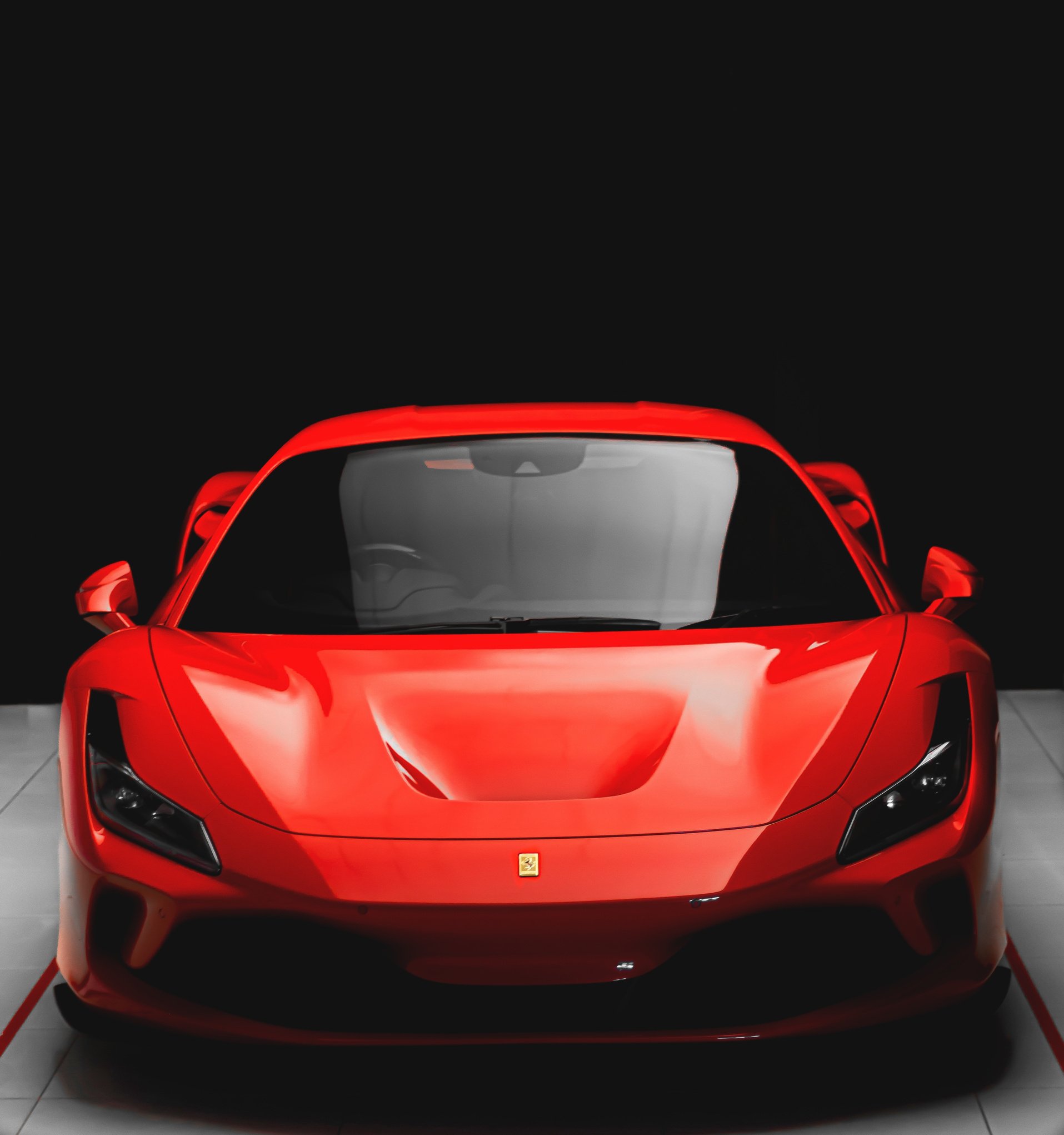 Red Ferrari Sports Car in Black Background